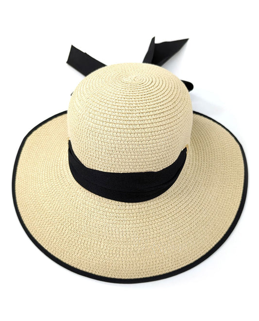 Beige straw hat with a black ribbon on a white background