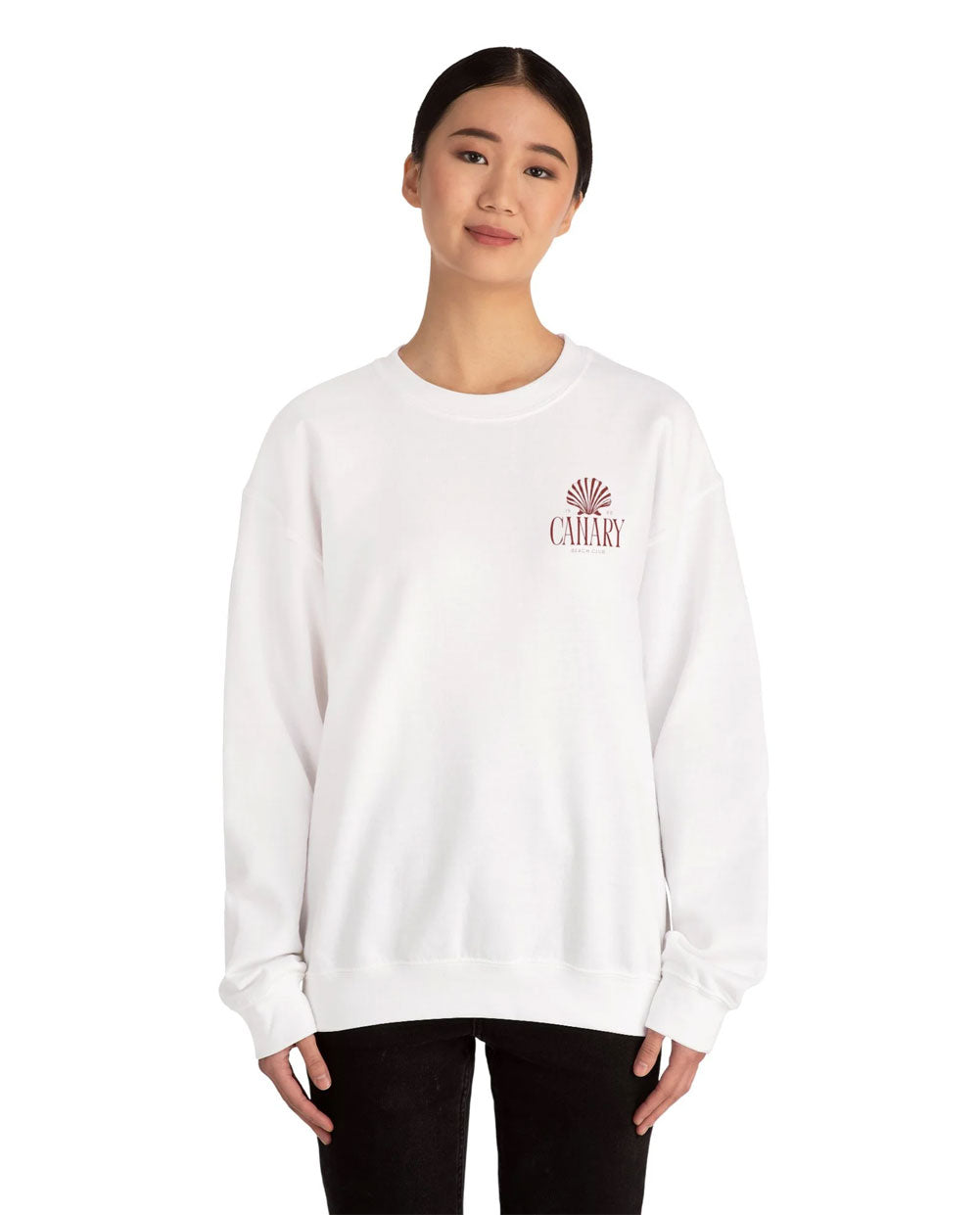 Person wearing a white sweatshirt with a logo on a white background